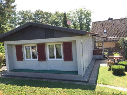 Waldsiedlung Romerstraße House | Wooden holiday home with winter garden
