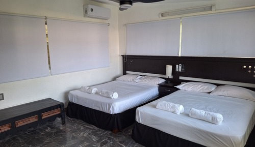 Superior Quadruple Room, 2 Queen Beds, Air conditioning, Partial Sea View
