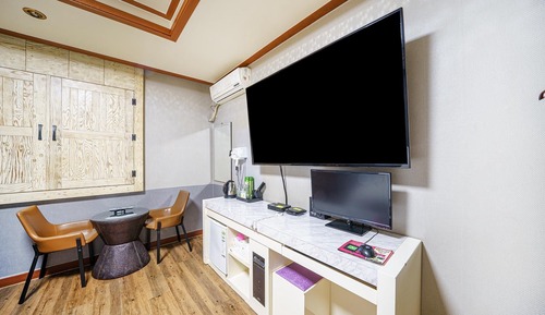 Room (Massage chair (65 inch TV Netflix ava)