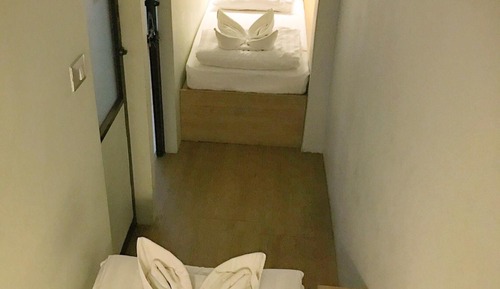 Twin Bed with Shared Bathroom