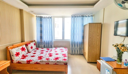 Deluxe Quadruple Room, 2 Queen Beds, Refrigerator, City View