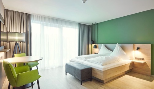 Dreibettzimmer mit Balkon