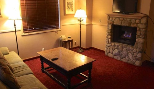 Suite, 1 King Bed ( with either Sofa Sleeper or 2 Twin Rollaways) AC in Bedroom only