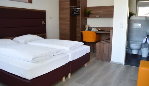 Motel Suite (2 rooms, each with its own street-side entrance, connecting door)