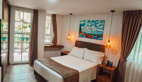 Basic Single Room, Balcony, Garden View