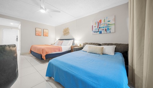 Deluxe King w/ Balcony, Kitchenette & Sofa Bed