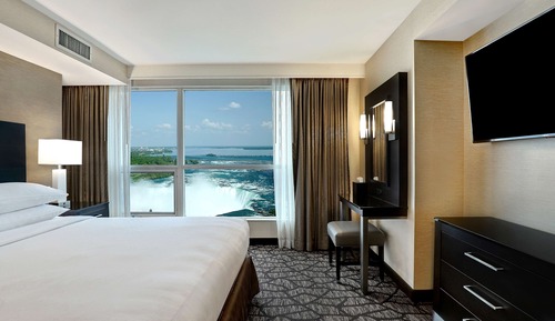 King Bed with Sofa Bed and partial view of Niagara Falls - Floors 10-25