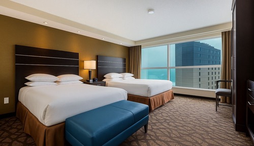 2 Queen Beds with Sofa Bed, Whirlpool and partial view of Niagara Falls - Floor 15