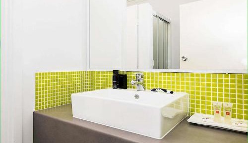 Standard Room with One Queen Bed and Two Single Beds