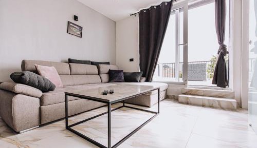 One-Bedroom Apartment with Balcony and City View