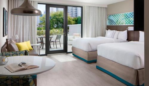 Studio with Two Queen Beds with Sofa Bed and Patio