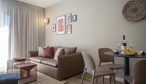 One-Bedroom Suite with Balcony and Pool View