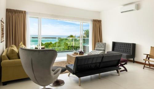 King Suite with Ocean View with homemade Sorbet, a tropical evening mocktail, local snacks with tea/coffee, and a dining experience by the white sands