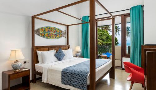 Deluxe Double Room with with refreshing mocktails, beachfront dining, evening tea with snacks at Café Surf, and homemade ice cream.