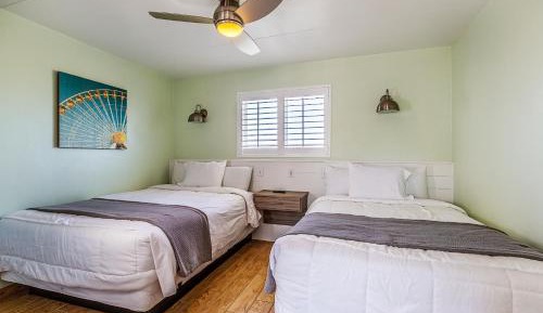 One Bedroom Suite with Two Queen Beds Efficiency and Partial Ocean View