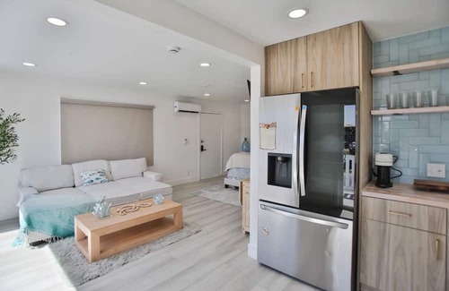 Huntington Harbour Cottage | STEPS TO PRIVATE BEACH FRONT PANORAMIC OCEAN VIEWS! Home - parking lot - sand.
