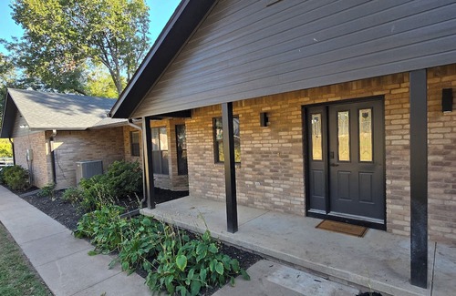 Grove House | Giant10-bedroom lakefront home with large pool, hot tub, and dock