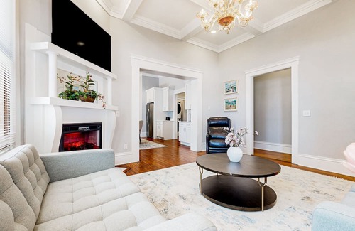 Metropolitan House | Dog-friendly duplex with front porch, fenced yard & walkable location