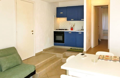 Porto Rotondo Apartment | Lovely apartment for 2 guests with WIFI, pool, A/C, TV, terrace, pets allowed and parking