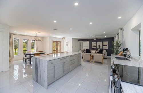Palm River Estates House | Gorgeous Naples home with open-concept layout, sunroom, enclosed pool, & AC