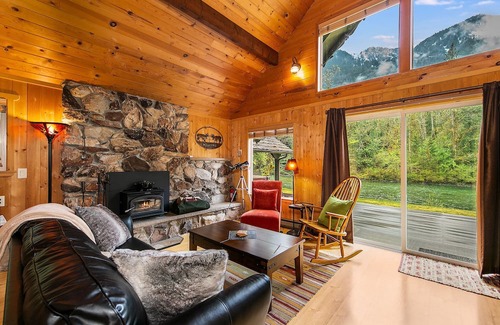 Baring Cabin | Delightful river front cabin with new hot tub and mountain views.