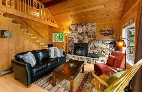 Baring Cabin | Delightful river front cabin with new hot tub and mountain views.
