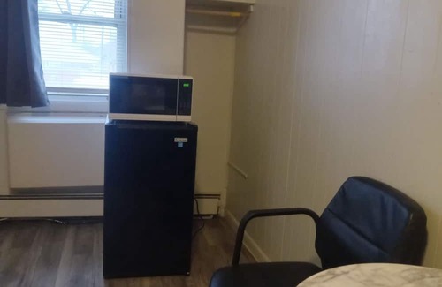 Savage House | Affordable cozy room meets unbeatable convenience.