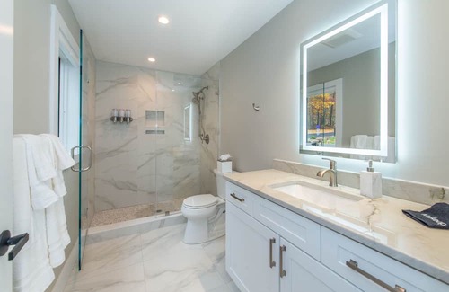 Sparta Township House | Aspen-style lakefront retreat house with hot tub, game room