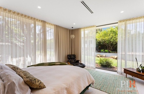 Rhyll House | 4 Br Family Oasis with 70s Vibe