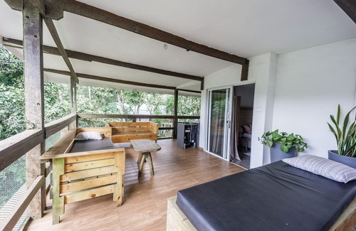 Aburi Bed & Breakfast | Rustic and unique private room with large wraparound balcony up in the Trees!