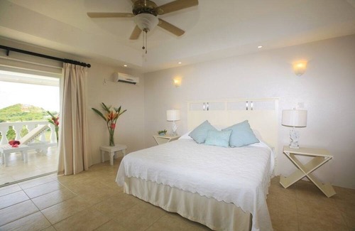 Cap Estate Villa | Fairway And Ocean Views - Blue Moon 4 Bedroom Villa by RedAwning