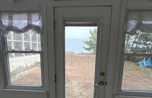 Slaughter Beach House | Beachfront Cottage with detached screened porch with stunning beach views.
