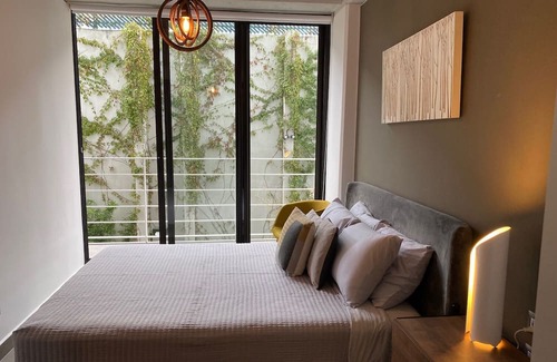 Zona 8 Apartment | Luxury Cayala 2BR/2BA suite w/sunlit balcony near US Embassy, modern amenities.