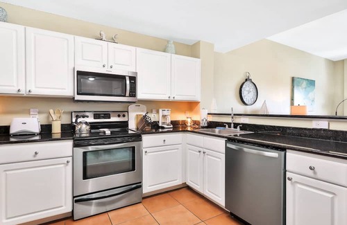 Madeira Beach Condo | Bay front condo, shared pool and hot tub right next to the beach