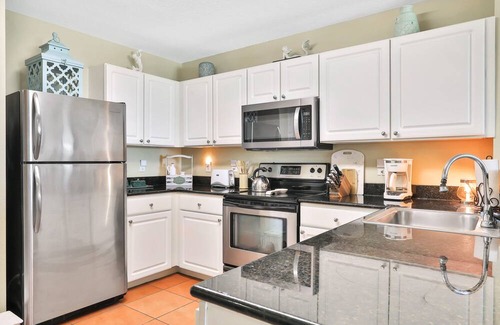 Madeira Beach Condo | Bay front condo, shared pool and hot tub right next to the beach