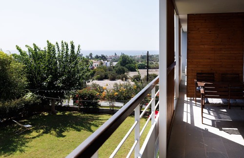 Pentakomo Apartment | Euploia | One-Bedroom Apartment, Art by PraXis Apartments