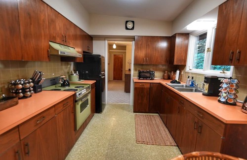 Madison House | Vintage-Inspired Luxury Retreat w/Hot Tub, Sauna & 1970s Garage Hangout
