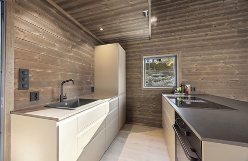 Kviteseid House | This house has a beautiful and unique location on the edge of Lake Vråvatn and gives you the feeling of 'coming home'.