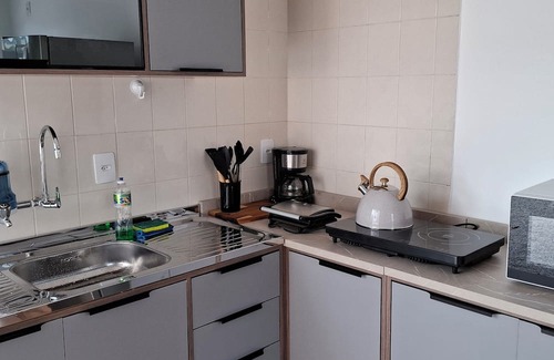 Armacao Apartment | One bedroom and living room apartment with fully equipped kitchen.