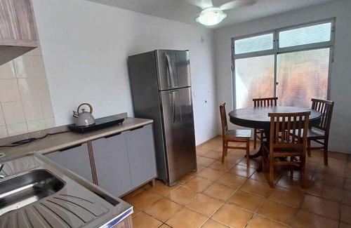 Armacao Apartment | One bedroom and living room apartment with fully equipped kitchen.