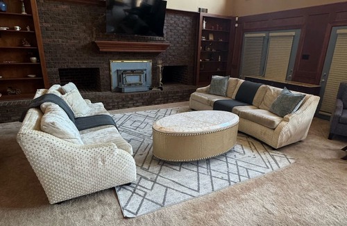 Olive Branch House | Grand 8-Bedroom Brick Southern Home with Lakeview Backyard.