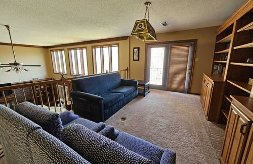 Olive Branch House | Grand 8-Bedroom Brick Southern Home with Lakeview Backyard.