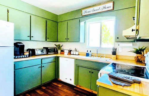 Old Station House | Charming 3-bedroom cabin in with AC, spa, game room, firepit & EV charger