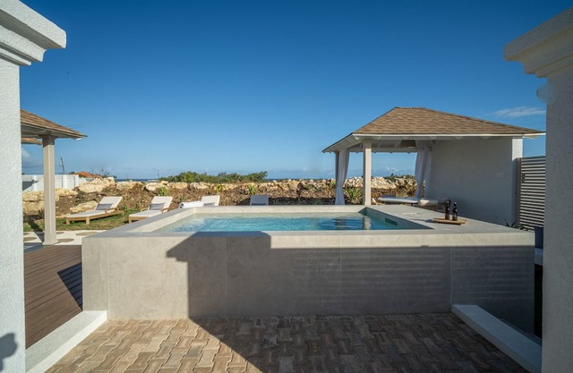 Serene, air-conditioned two-bedroom villa with plunge pool and ocean views.