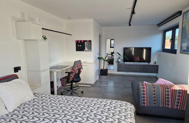 Room with private bathroom, garden and modern amenities in a beautiful area.