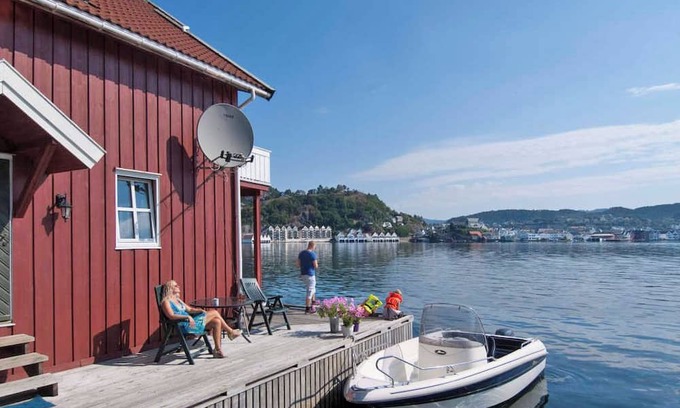 Flekkefjord Apartment | Holiday apartment "Fagerstrand 1", in Flekkefjord, southern Norway, in a beautiful location directly on the water, 4-6 persons, open living-dining area, 2 bedrooms, 1 loft with double mattress, 1 bathroom, Internet, own small veranda with access t...