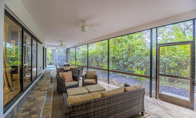 Palm River Estates House | Gorgeous Naples home with open-concept layout, sunroom, enclosed pool, & AC