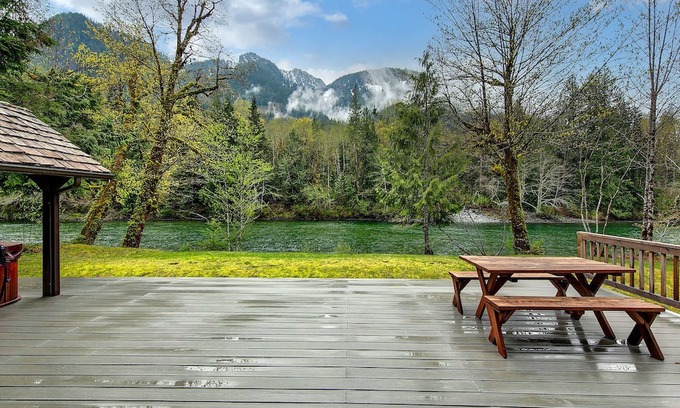 Baring Cabin | Delightful river front cabin with new hot tub and mountain views.