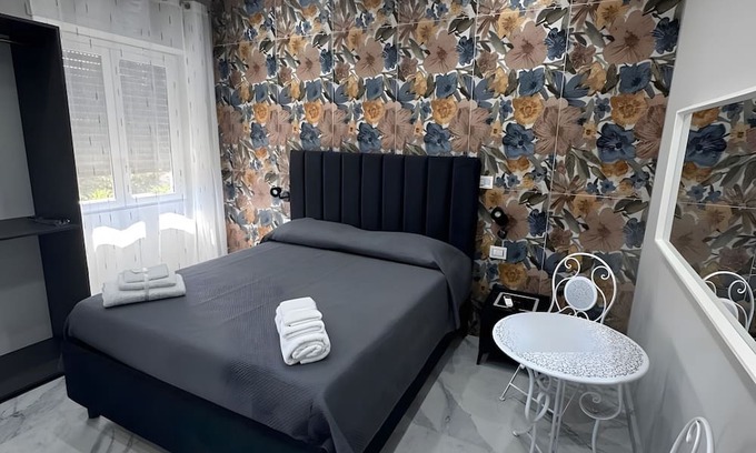 Monte Po-Nesima-San Leone-Rapisardi Apartment | Room 'Dolce Relax - Tripla Luxury' with Wi-Fi and Air Conditioning