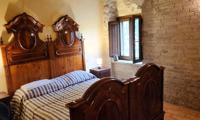 Cagli House | Cà Paradiso - Room '800 private bath, sitting area, fireplace and kitchen shared